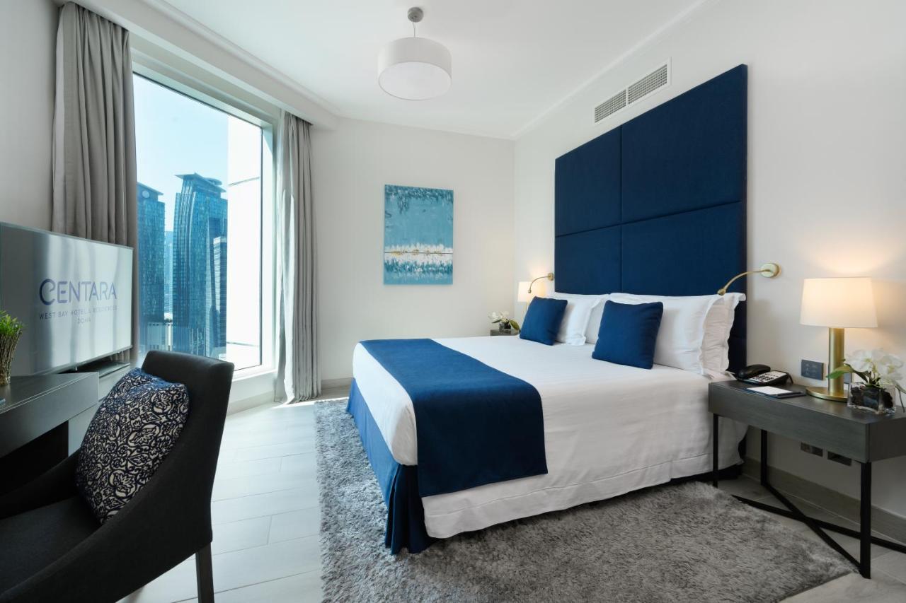 Centara West Bay Hotel & Residences Доха Экстерьер фото A bedroom at the Address Downtown Hotel