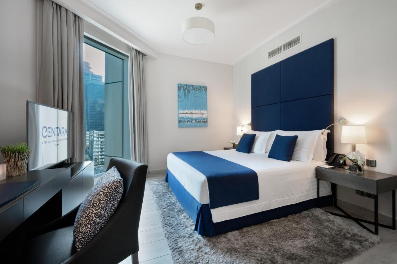 Centara West Bay Hotel & Residences Доха Экстерьер фото A bedroom at the Address Downtown Hotel